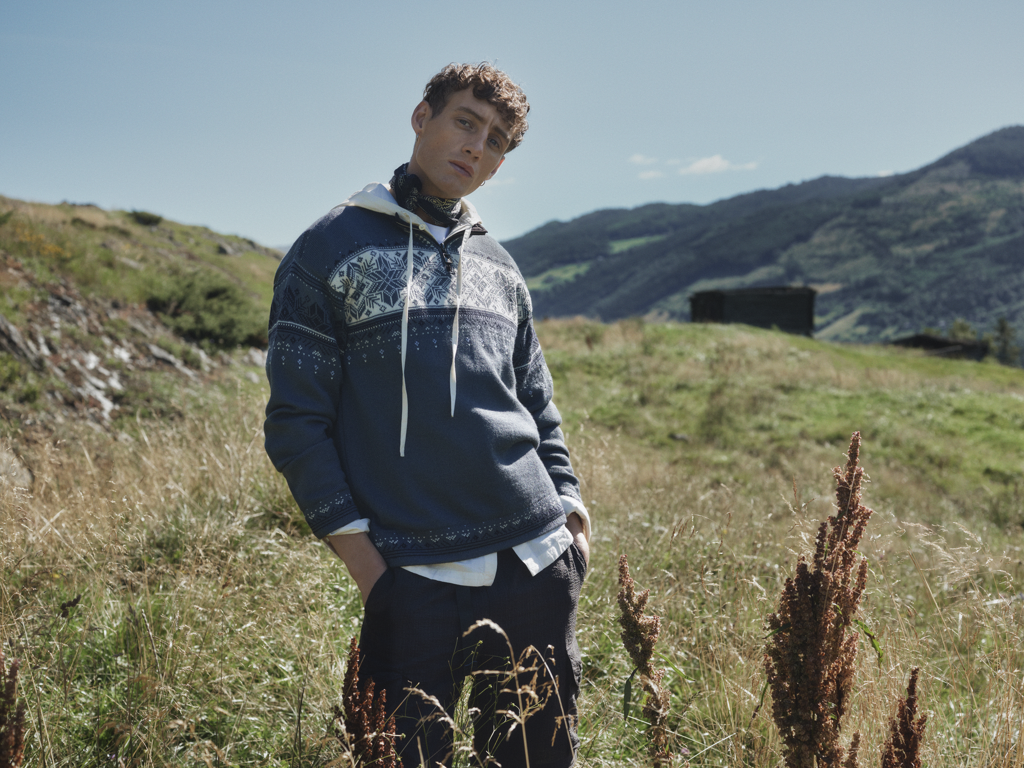 Male model wearing a Dale of Norway wool sweater spring time